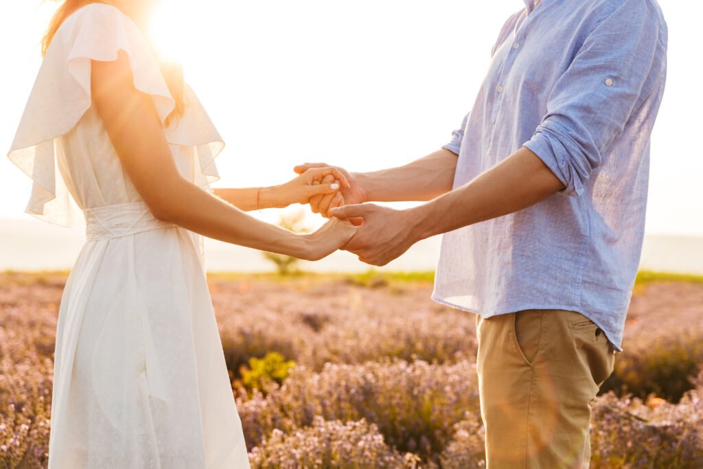 A couple holding hands symbolizing trust, connection, and open communication