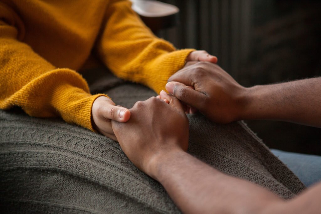 Love expressed through a couple holding hands gently during a calm emotional moment