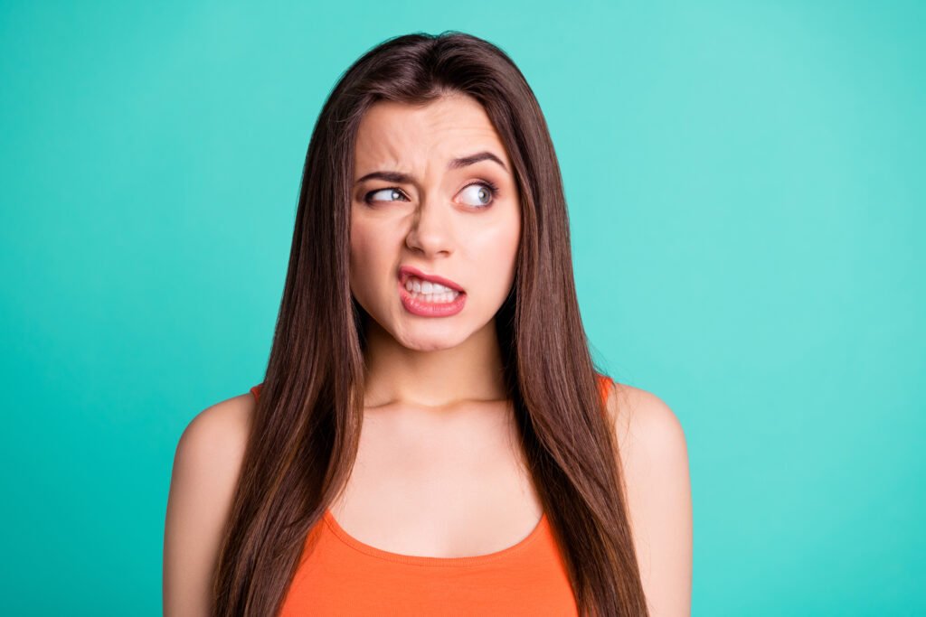 Woman showing an anxious expression while overthinking and feeling stressed